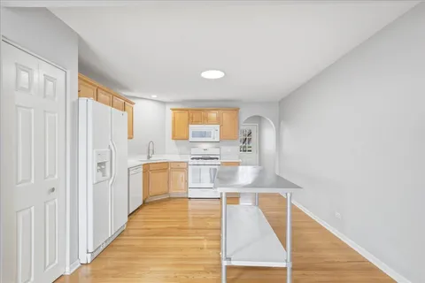 a bathroom with a tub shower and sink