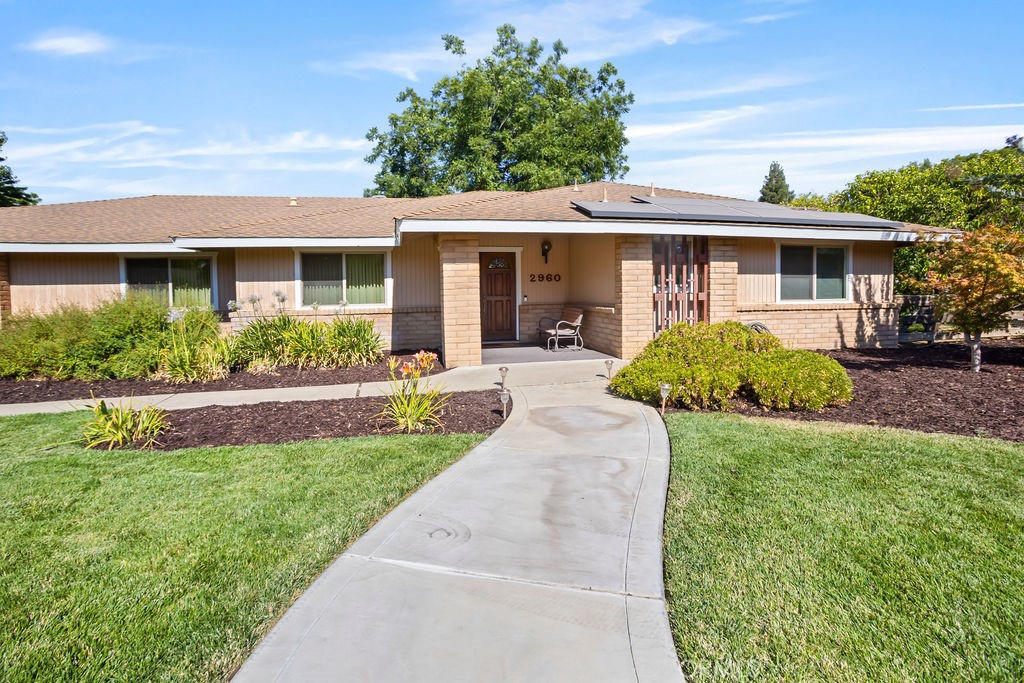 2960 Whitegate Drive Merced, CA 95340 - Photo 15 of 48 a front view of a house with a garden and porch
