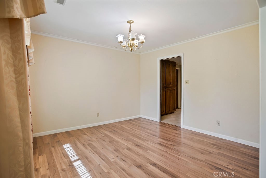2960 Whitegate Drive Merced, CA 95340 - Photo 17 of 48 a view of an empty room with wooden floor