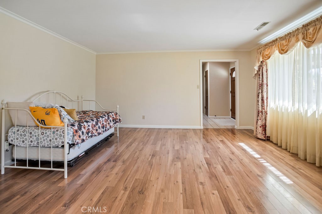 2960 Whitegate Drive Merced, CA 95340 - Photo 18 of 48 a bedroom with a bed and a mirror