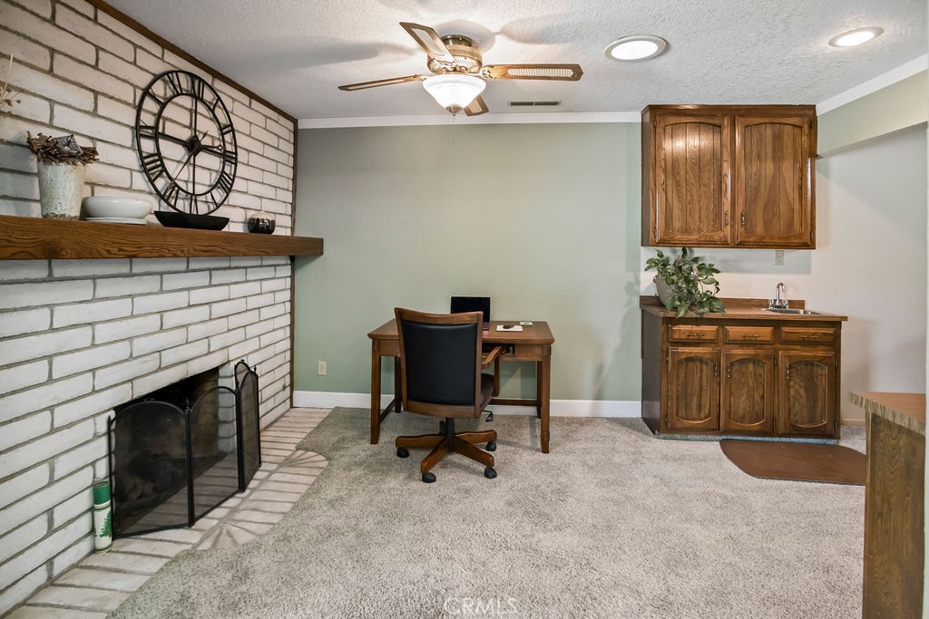 2960 Whitegate Drive Merced, CA 95340 - Photo 22 of 48 a workspace with furniture and fireplace