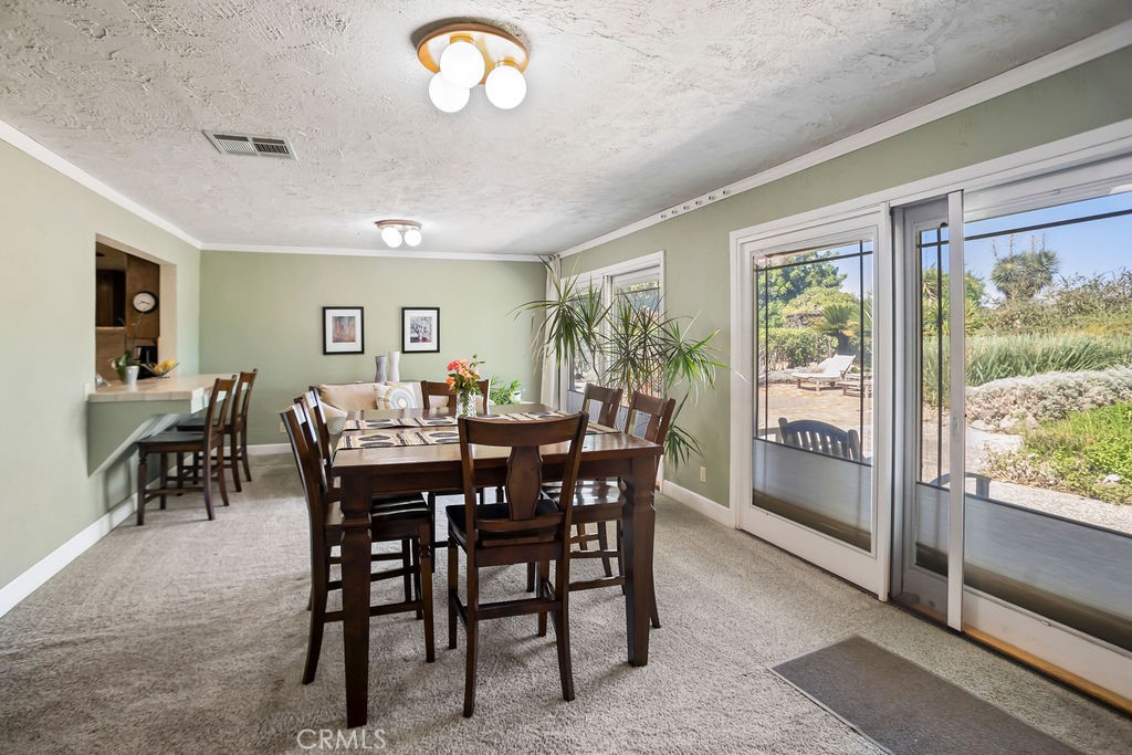 2960 Whitegate Drive Merced, CA 95340 - Photo 27 of 48 a view of a dining room with furniture window and outside view
