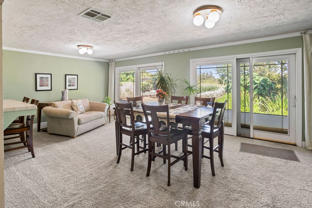 2960 Whitegate Drive Merced, CA 95340 - Photo 28 of 48 a view of a dining room with furniture window and outside view