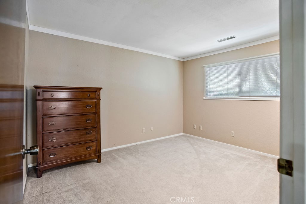 2960 Whitegate Drive Merced, CA 95340 - Photo 34 of 48 a room with a bench and a cabinet