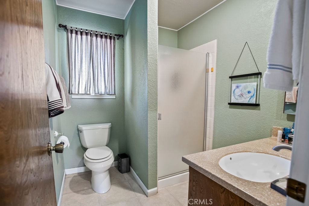 2960 Whitegate Drive Merced, CA 95340 - Photo 41 of 48 a white toilet sitting next to a bathroom sink