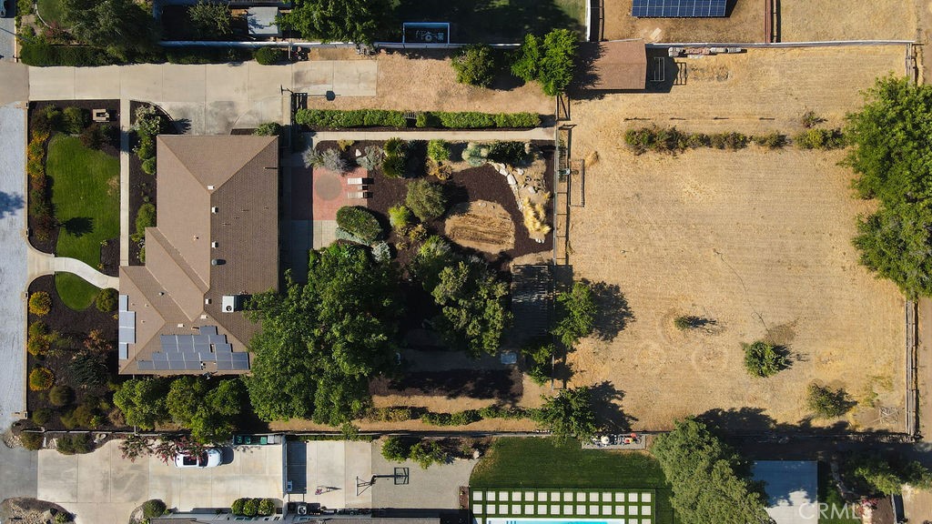 2960 Whitegate Drive Merced, CA 95340 - Photo 9 of 48 an aerial view of a house with a yard and large trees