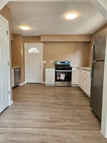a view of a kitchen with a sink