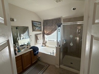 6720 Cromarty Lane Austin, TX 78754 - Photo 24 of 24 Relaxation awaits in this primary bathroom, featuring a deep soaking tub and a separate glass-enclosed shower.