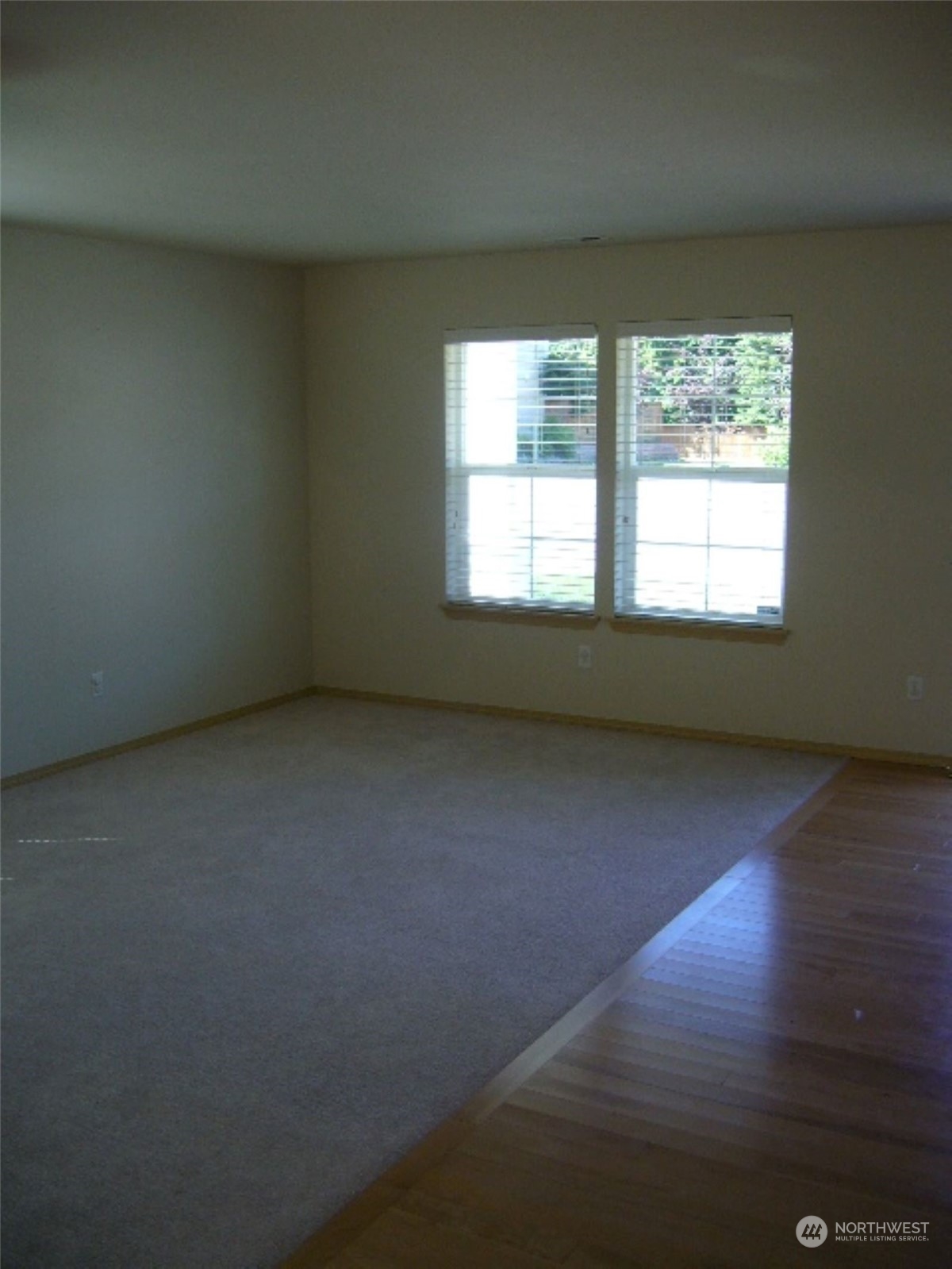 3602 154th Place Southeast Bothell, WA 98012 - Photo 13 of 22 an empty room with wooden floor and windows