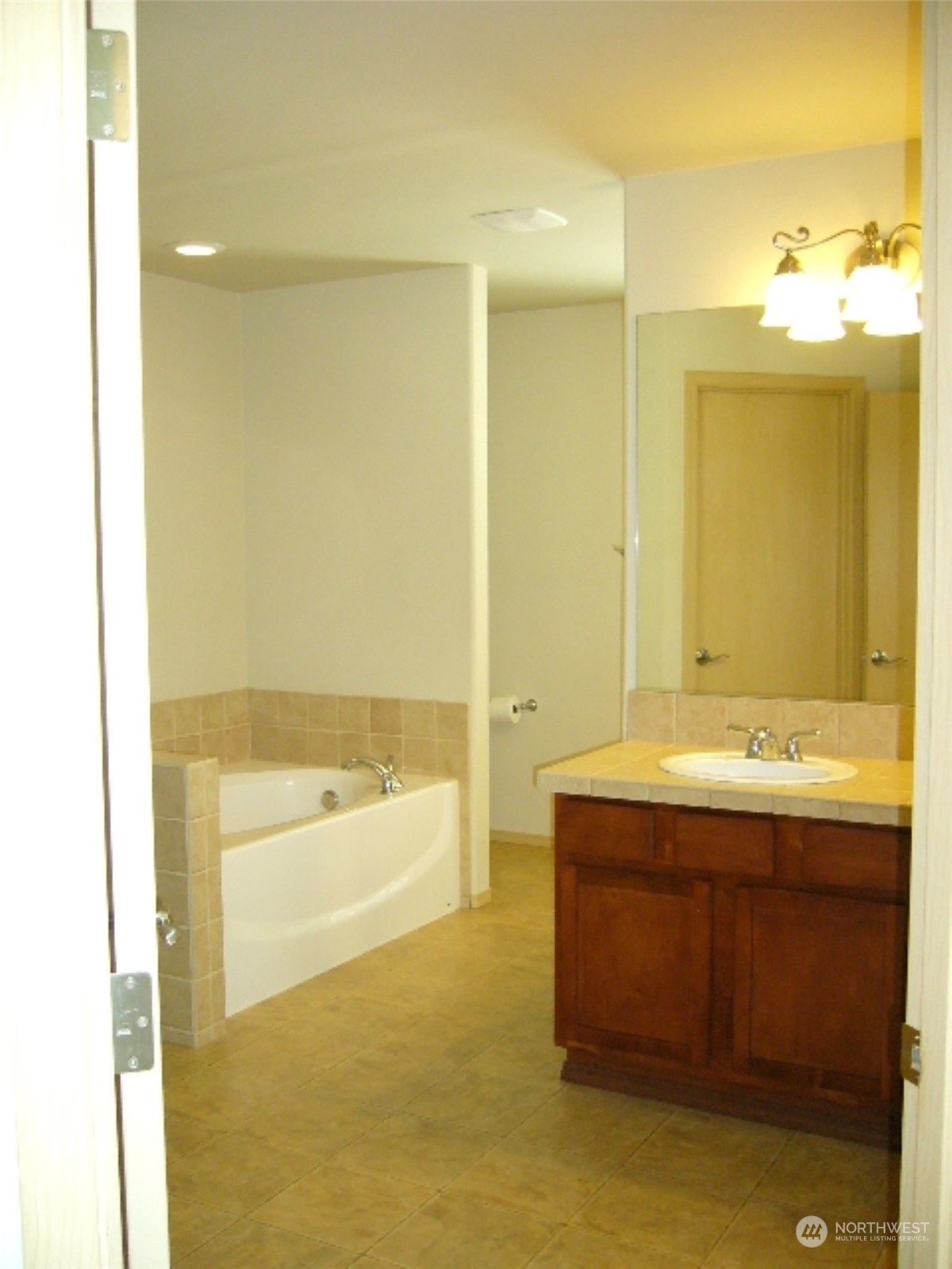 3602 154th Place Southeast Bothell, WA 98012 - Photo 14 of 22 a bathroom with a tub sink and mirror