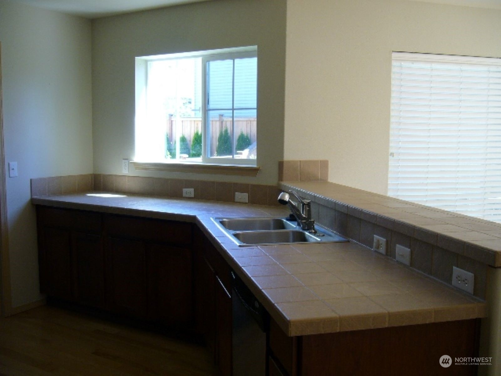3602 154th Place Southeast Bothell, WA 98012 - Photo 9 of 22 a kitchen with a sink cabinets and a window