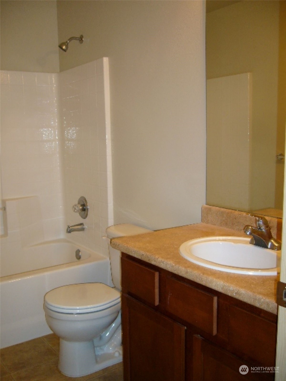 3602 154th Place Southeast Bothell, WA 98012 - Photo 10 of 22 a bathroom with a sink a toilet and shower