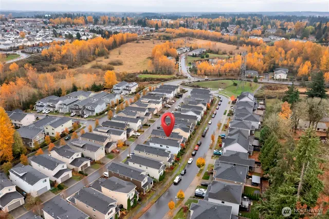 an aerial view of residential houses with outdoor space