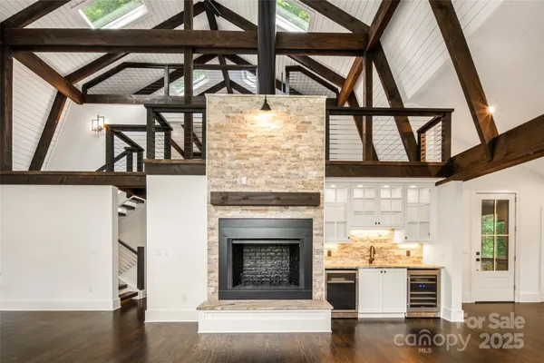 a view of entryway with wooden floor and stairs