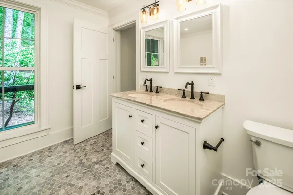 a view of a porch with furniture and a window
