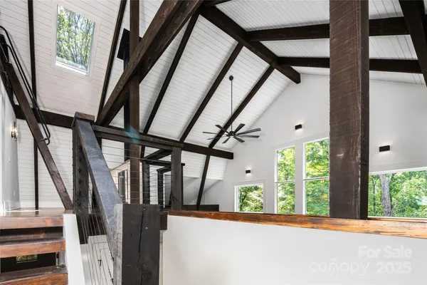 a view of closet with wooden floor