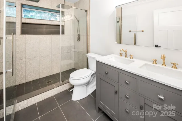 a view of a livingroom with furniture and staircase