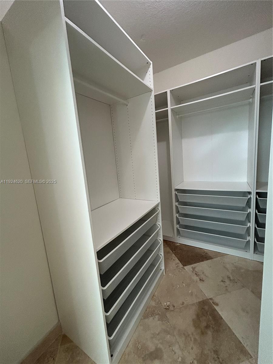 9055 Southwest 73rd Court, Unit 809 Miami, FL 33156 - Photo 25 of 47 a view of an empty room