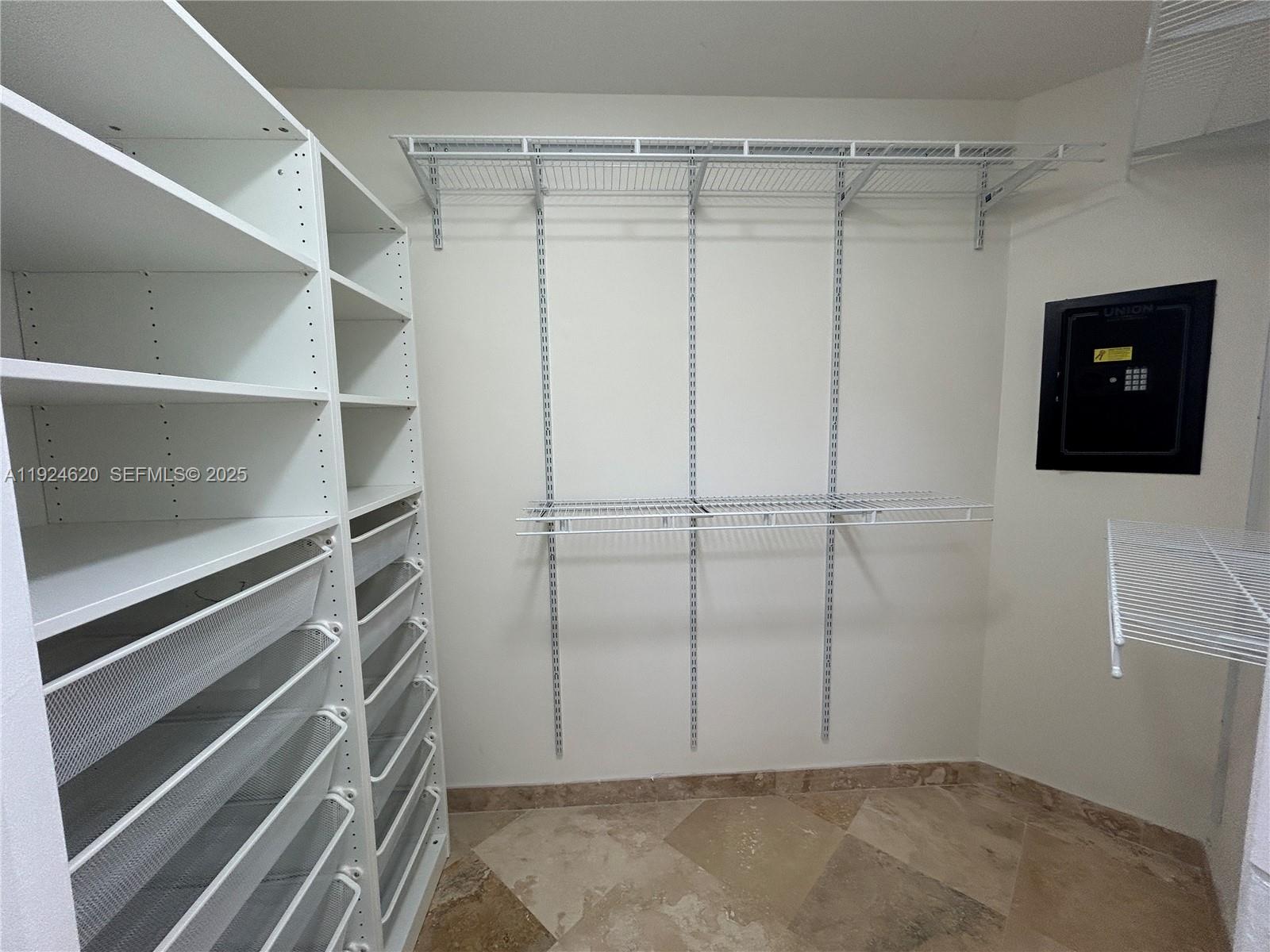 9055 Southwest 73rd Court, Unit 809 Miami, FL 33156 - Photo 33 of 47 a view of an empty walk in closet