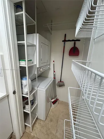 a bedroom with a bed and a potted plant