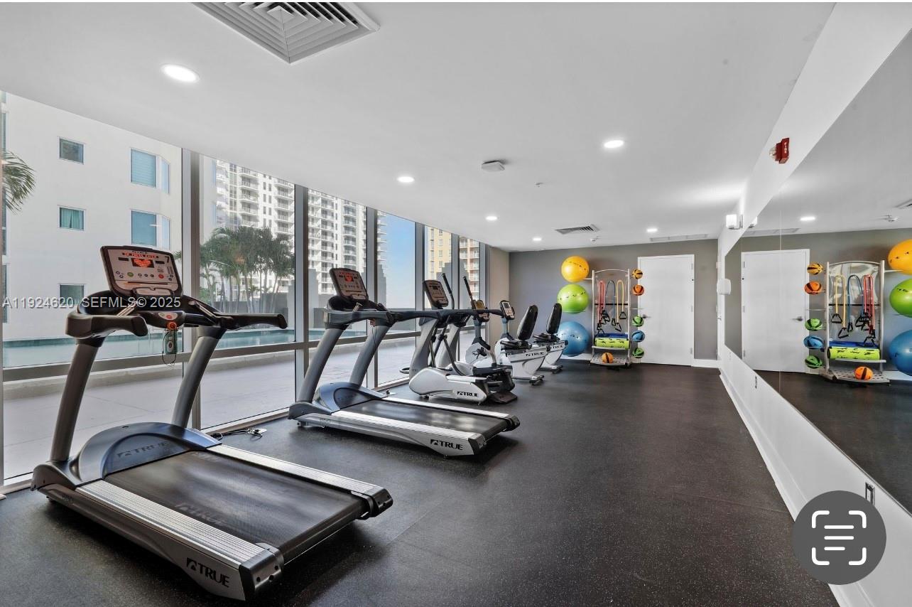 9055 Southwest 73rd Court, Unit 809 Miami, FL 33156 - Photo 44 of 47 a view of a room with gym equipment