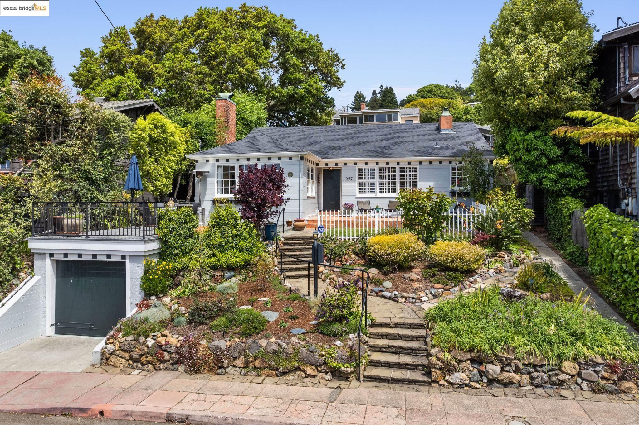 927 Santa Barbara Road Berkeley, CA 94707 - Photo 1 of 1 a front view of a house with a garden