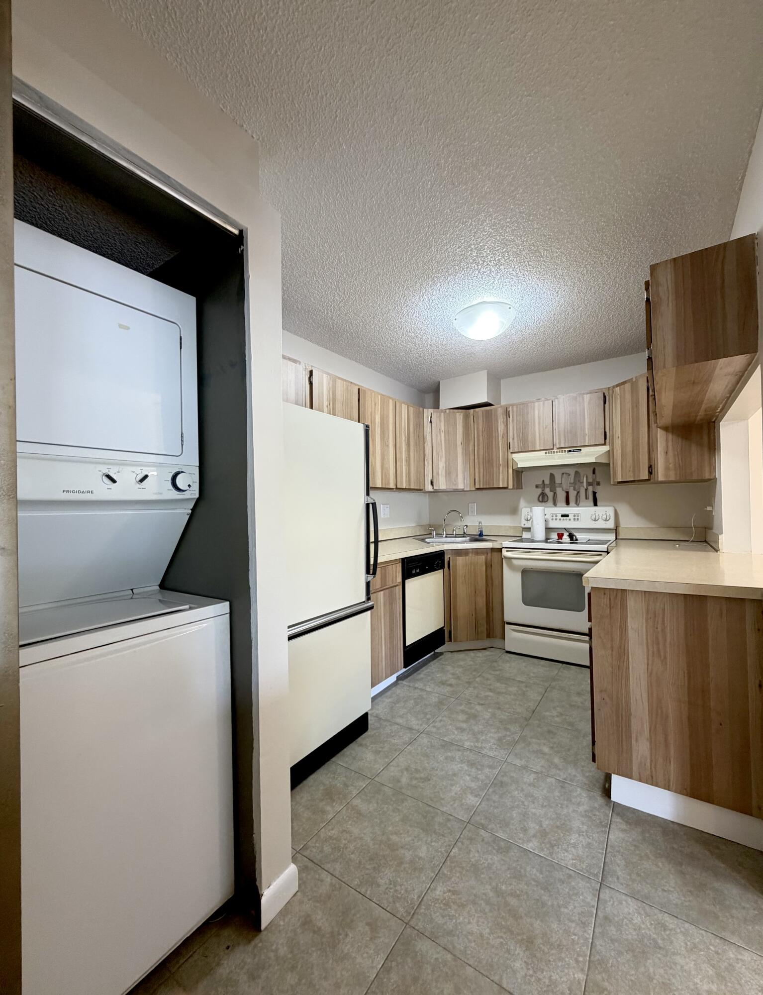 2575 Pine Ridge Way South, Unit A2 Palm Harbor, FL 34684 - Photo 4 of 10 2575 kitchen w laundry