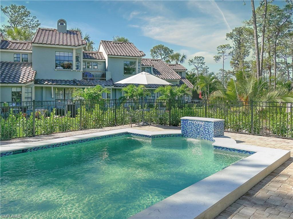Santa Cruz Boulevard Naples, FL 34112 - Photo 7 of 8 a view of a house with a yard and sitting area