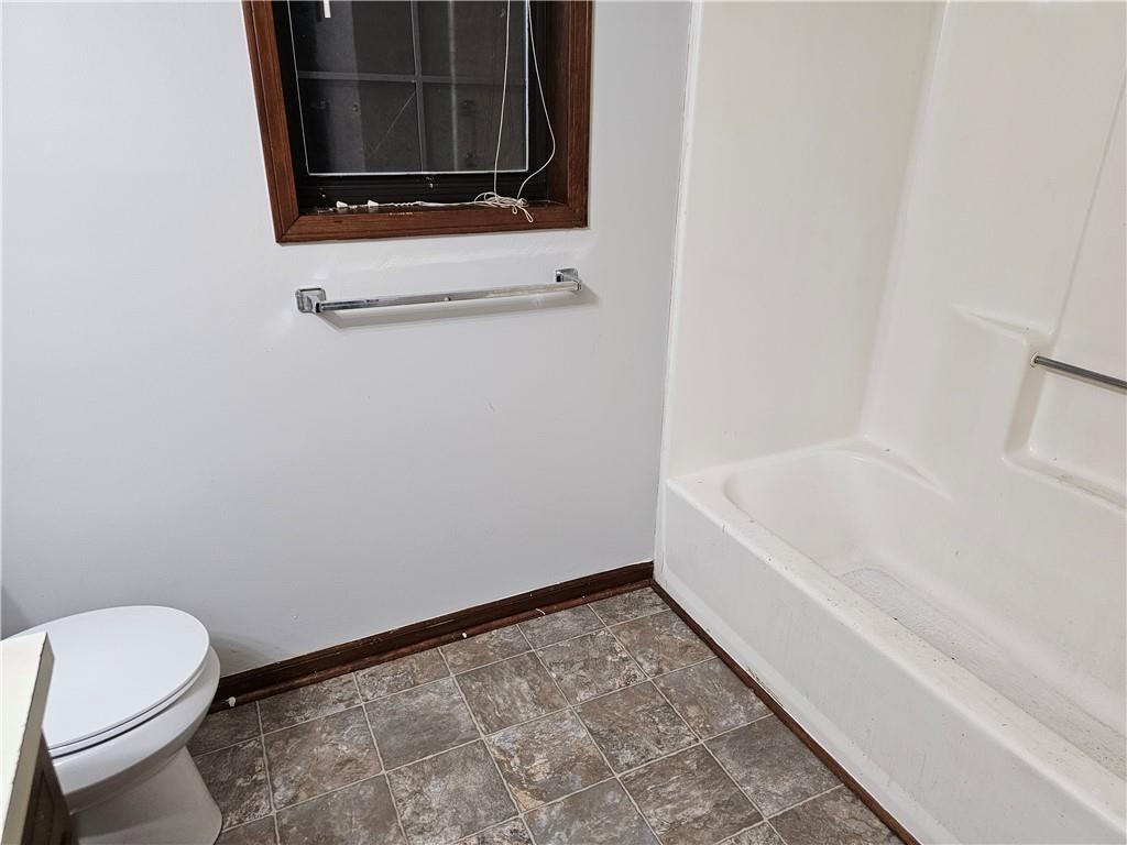 2835 Springdale Road, Unit B Snellville, GA 30039 - Photo 15 of 21 a bathroom with a toilet and a bathtub