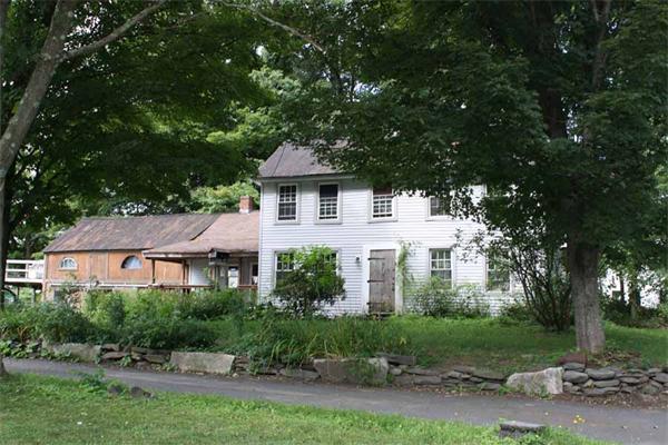 9 Thayer Corner Road Cummington, MA 01026 - Photo 1 of 1 a front view of a house with a yard and garage