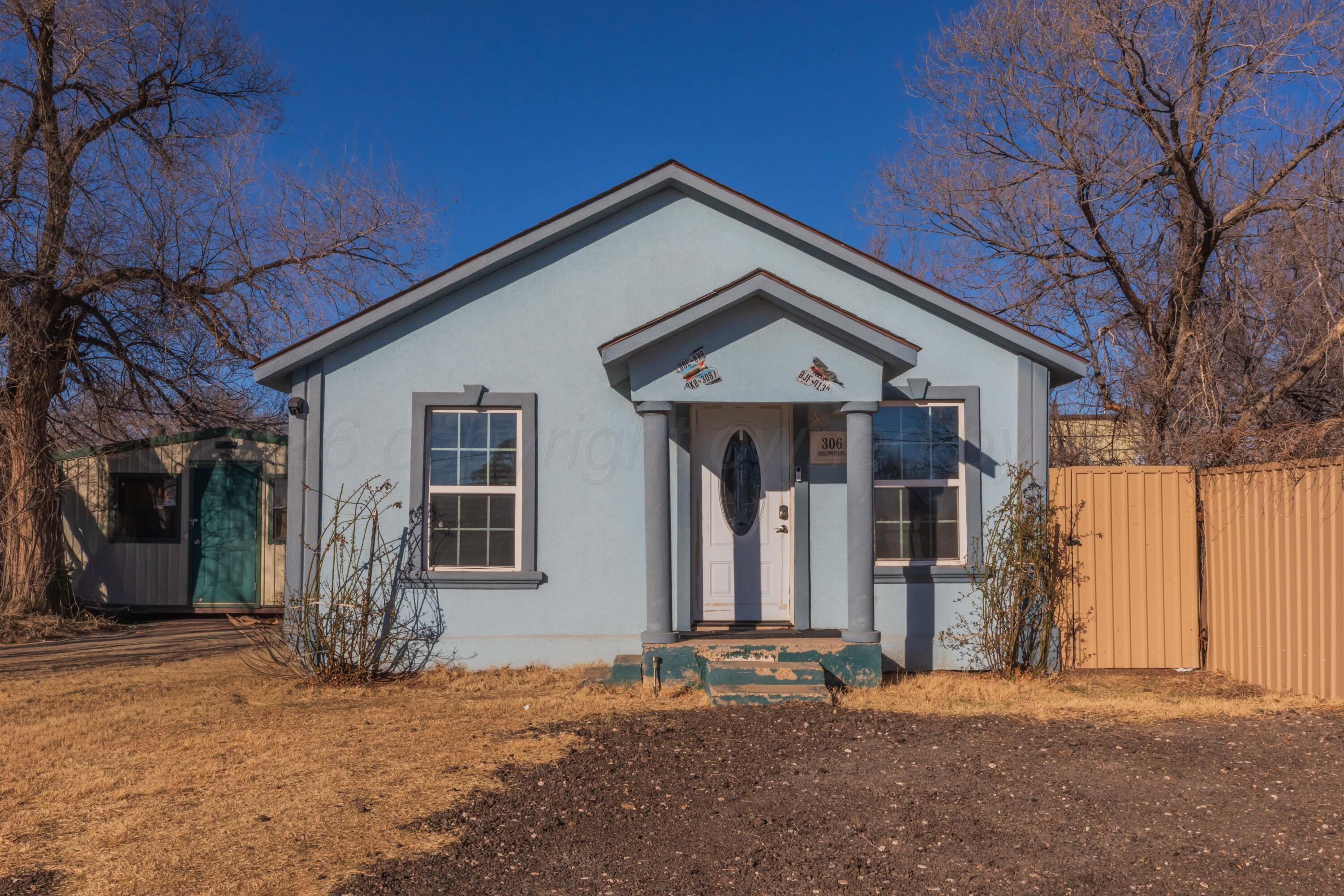 306 Browning Street Amarillo, TX 79104 - Photo 1 of 18 a front view of a house with a yard
