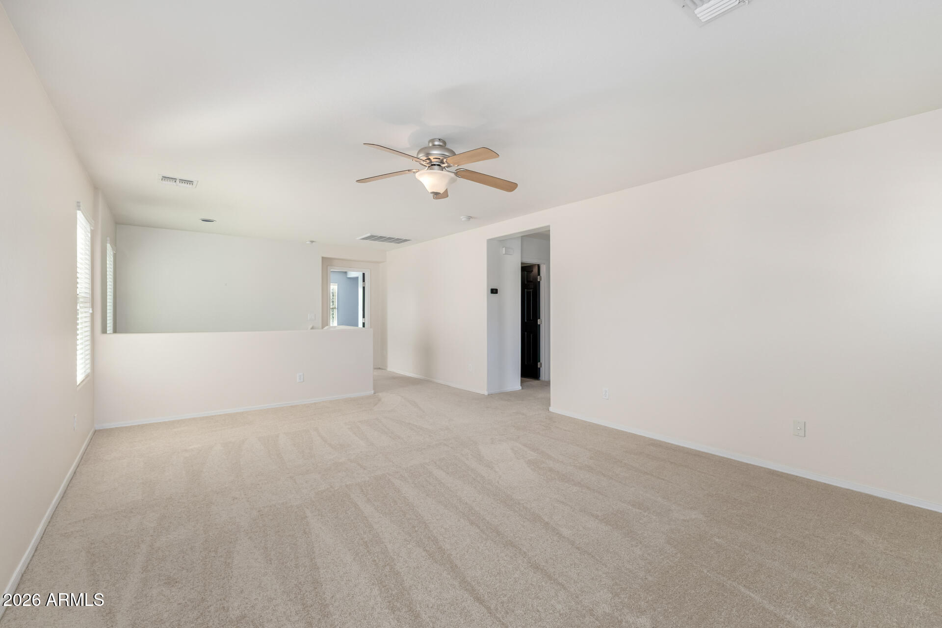 3535 East Terrace Avenue Gilbert, AZ 85234 - Photo 25 of 56 a view of a big room with closet and a ceiling fan