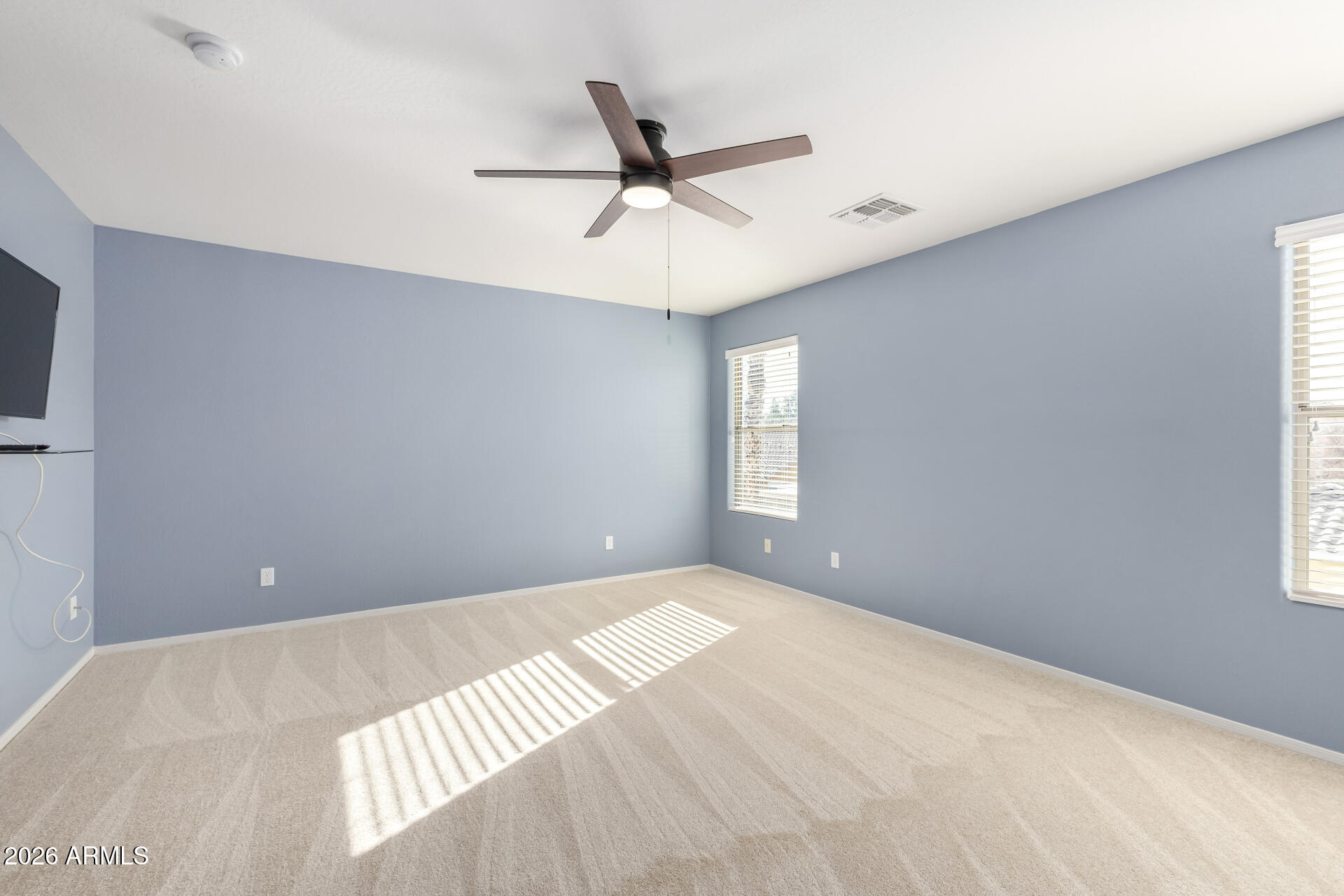 3535 East Terrace Avenue Gilbert, AZ 85234 - Photo 26 of 56 a view of a livingroom with a ceiling fan and window