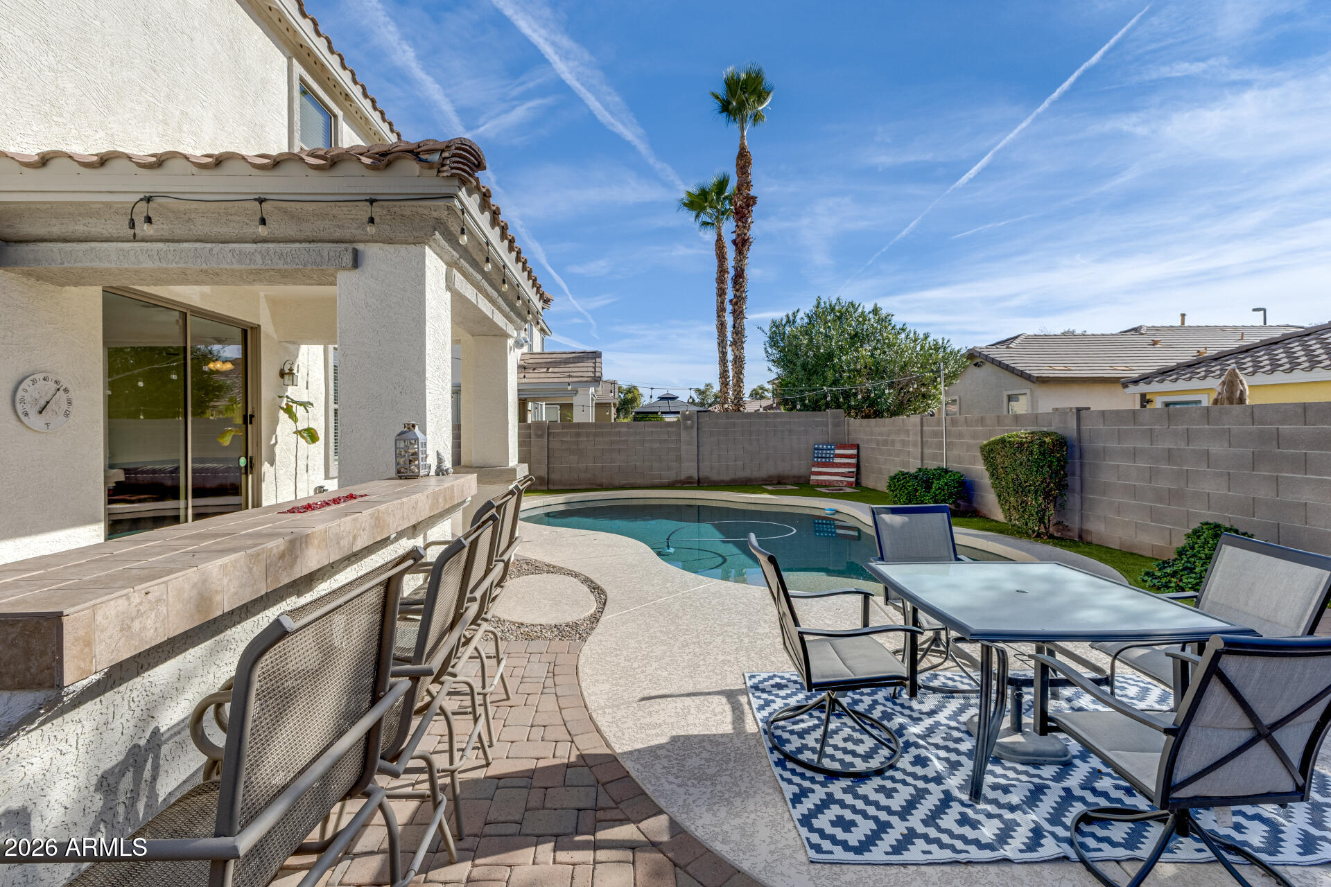 3535 East Terrace Avenue Gilbert, AZ 85234 - Photo 42 of 56 a view of a balcony with furniture and a potted plant