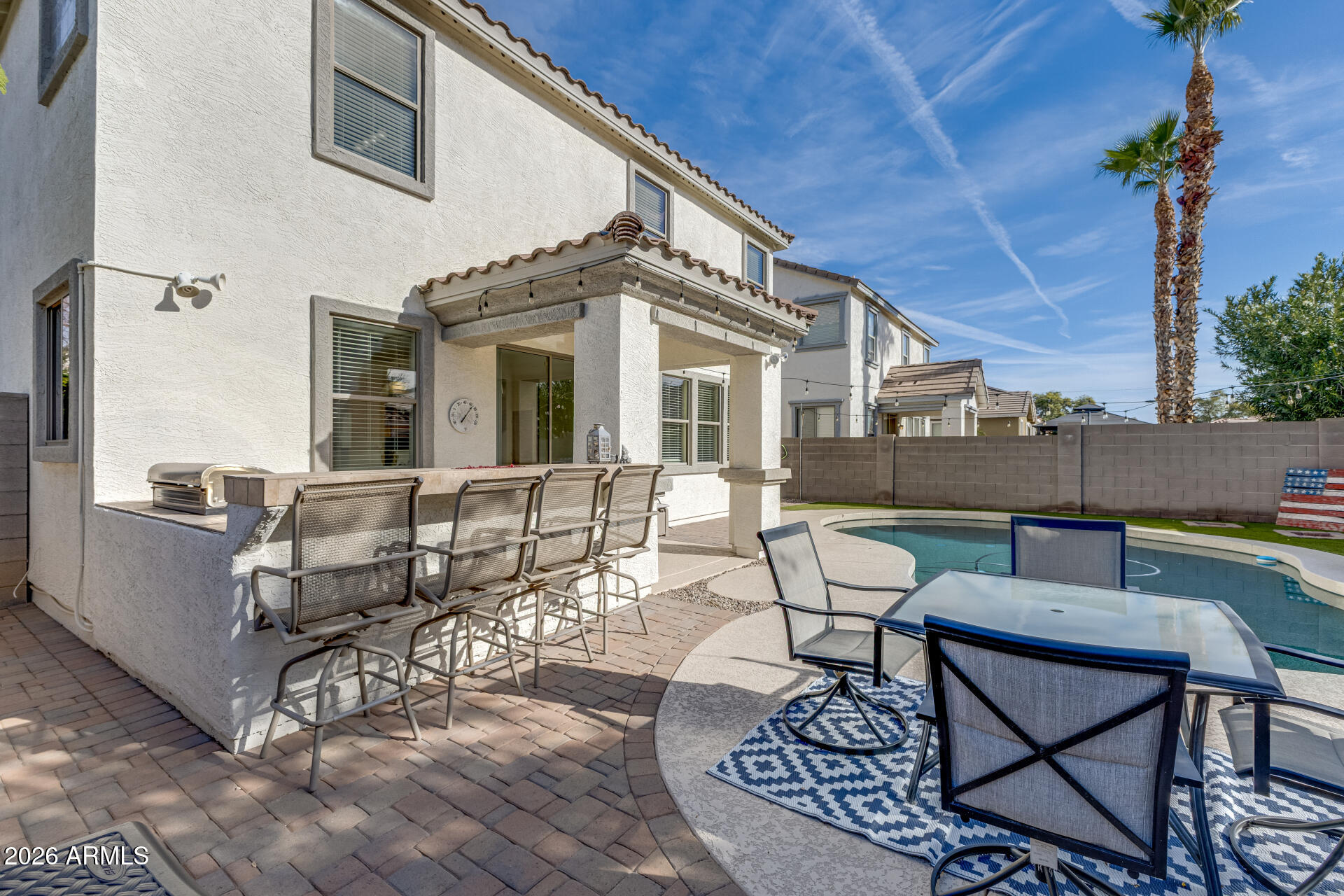 3535 East Terrace Avenue Gilbert, AZ 85234 - Photo 44 of 56 a view of a patio with couches chairs and a potted plant