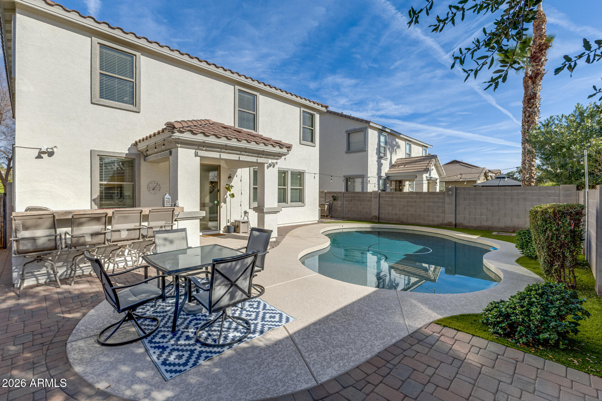 3535 East Terrace Avenue Gilbert, AZ 85234 - Photo 45 of 56 a view of a patio with table and chairs and potted plants