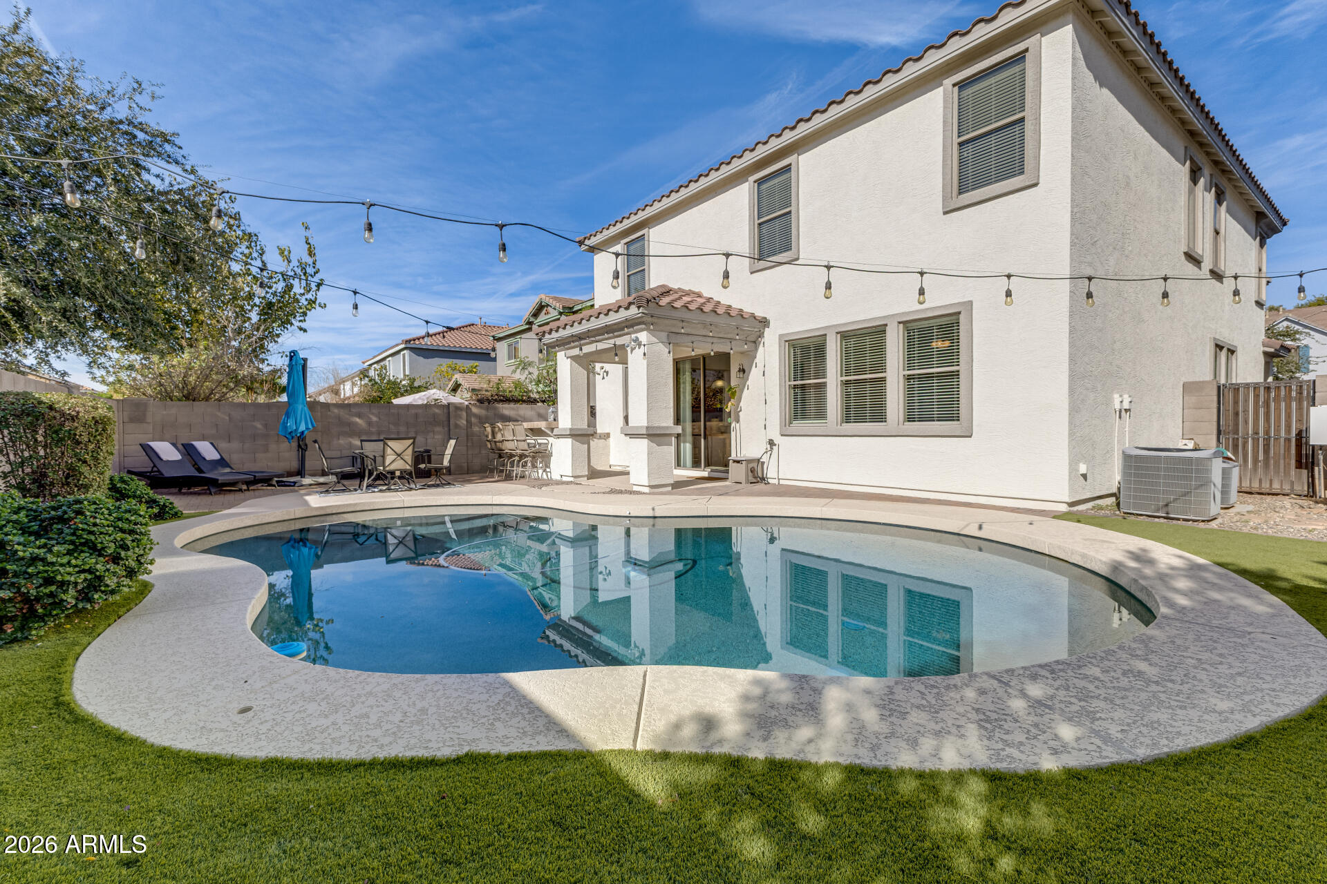 3535 East Terrace Avenue Gilbert, AZ 85234 - Photo 46 of 56 a view of a house with pool yard and furniture