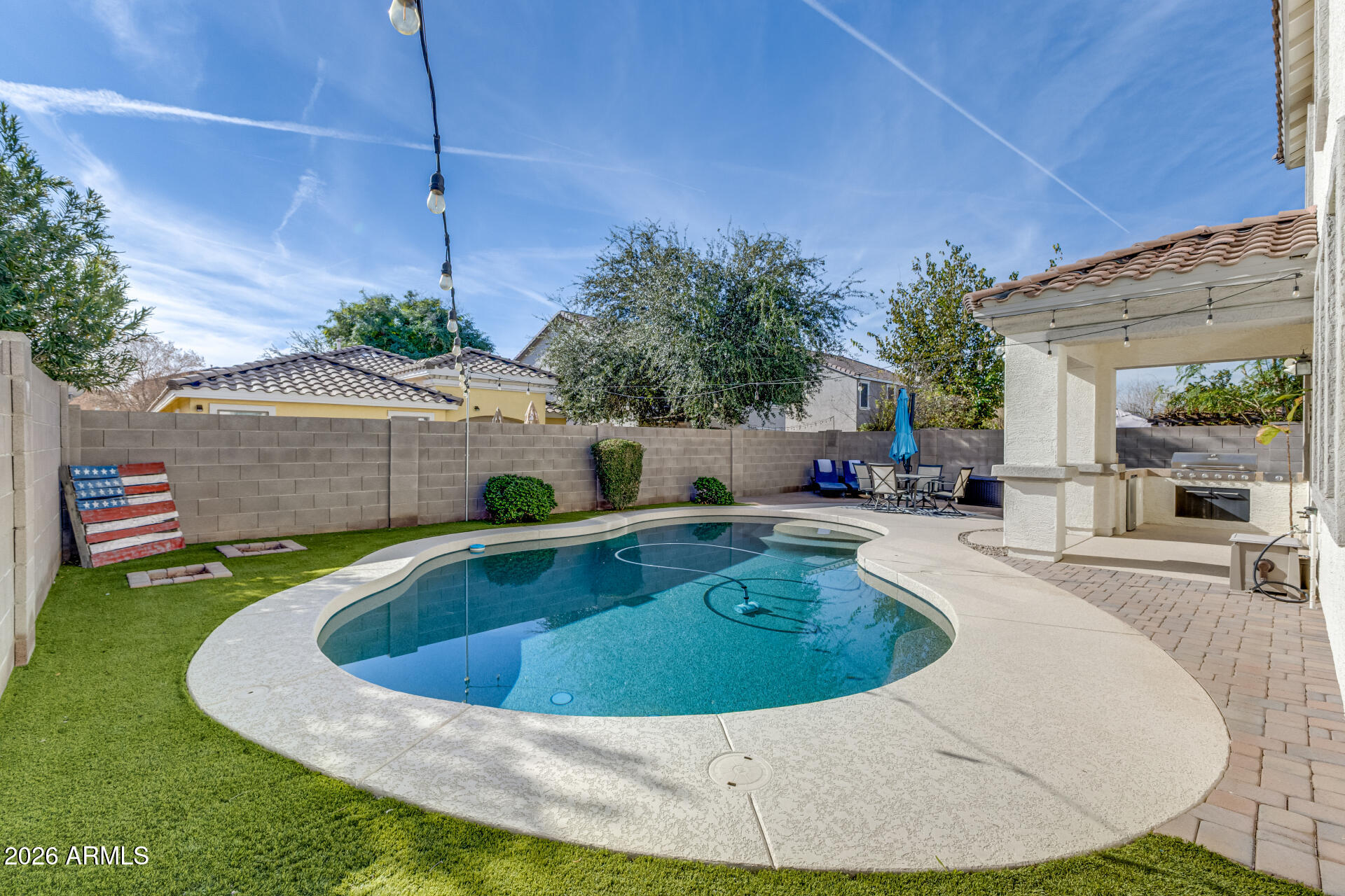3535 East Terrace Avenue Gilbert, AZ 85234 - Photo 48 of 56 a view of a swimming pool with sitting area
