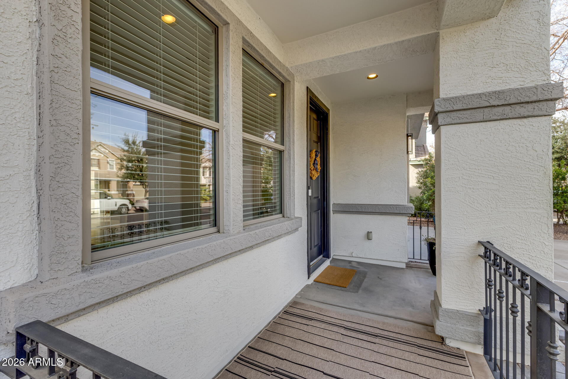 3535 East Terrace Avenue Gilbert, AZ 85234 - Photo 5 of 56 a view of a hallway with wooden floor and a large window