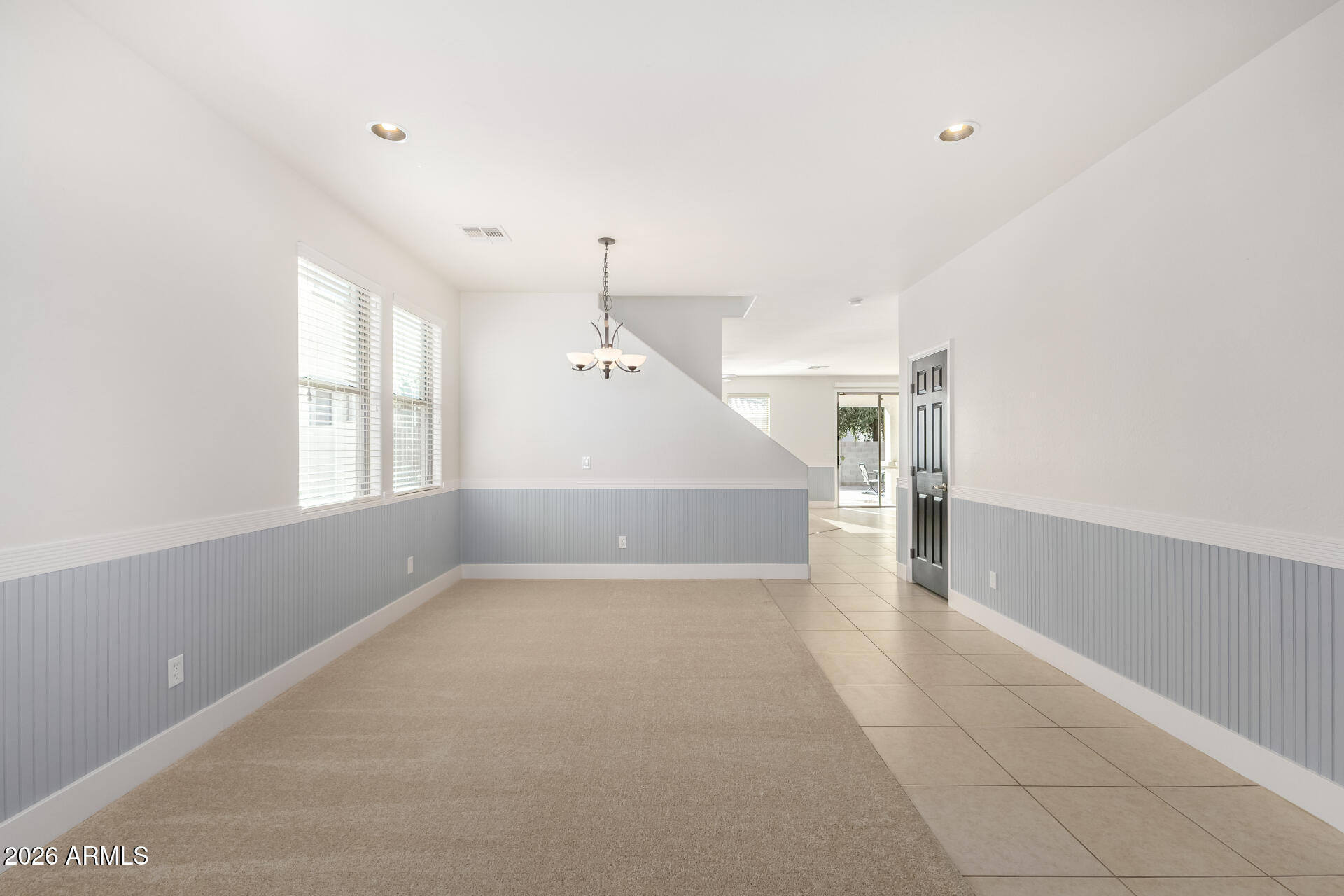 3535 East Terrace Avenue Gilbert, AZ 85234 - Photo 8 of 56 an empty room with windows and pillars in it