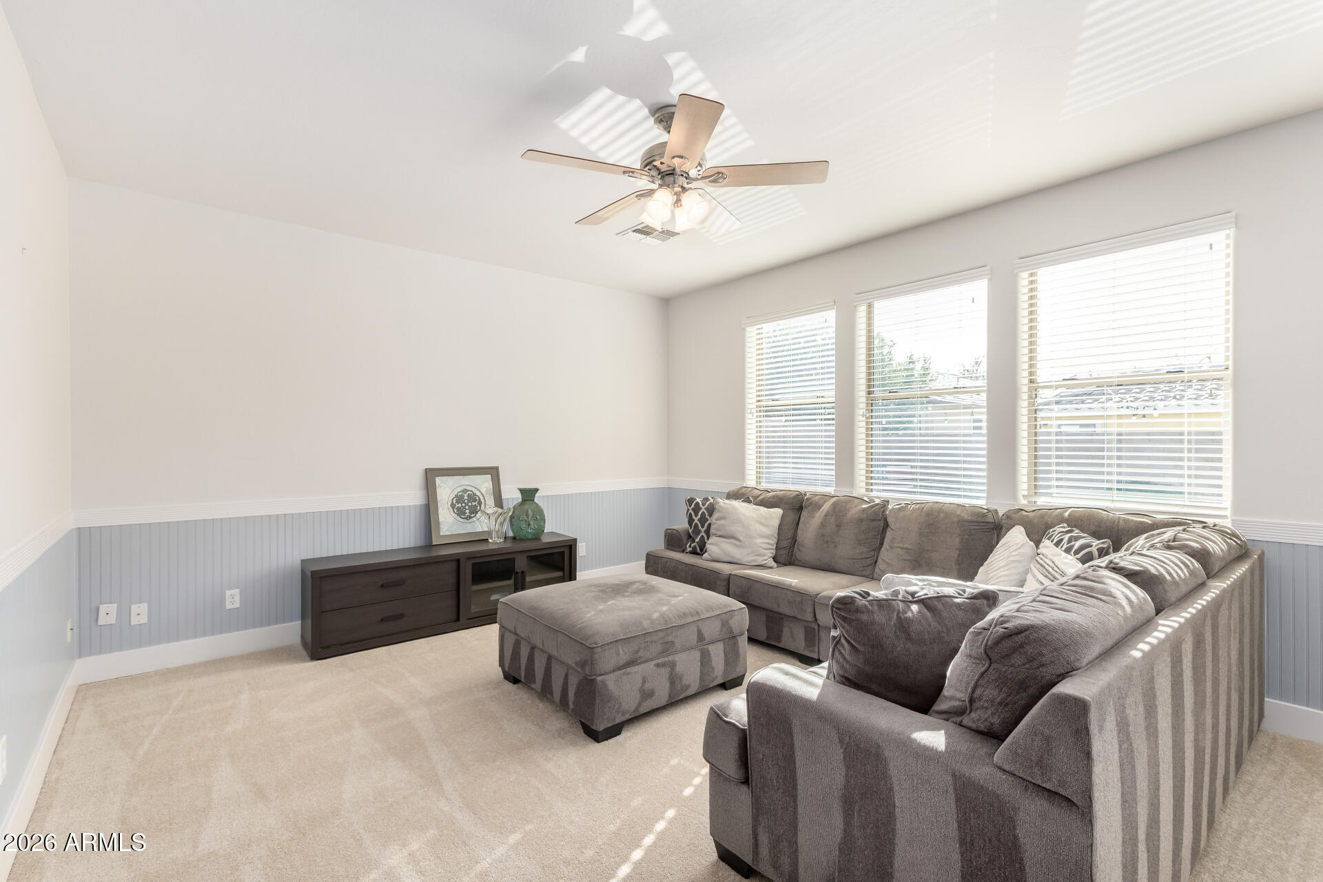 3535 East Terrace Avenue Gilbert, AZ 85234 - Photo 9 of 56 a living room with furniture and a large window