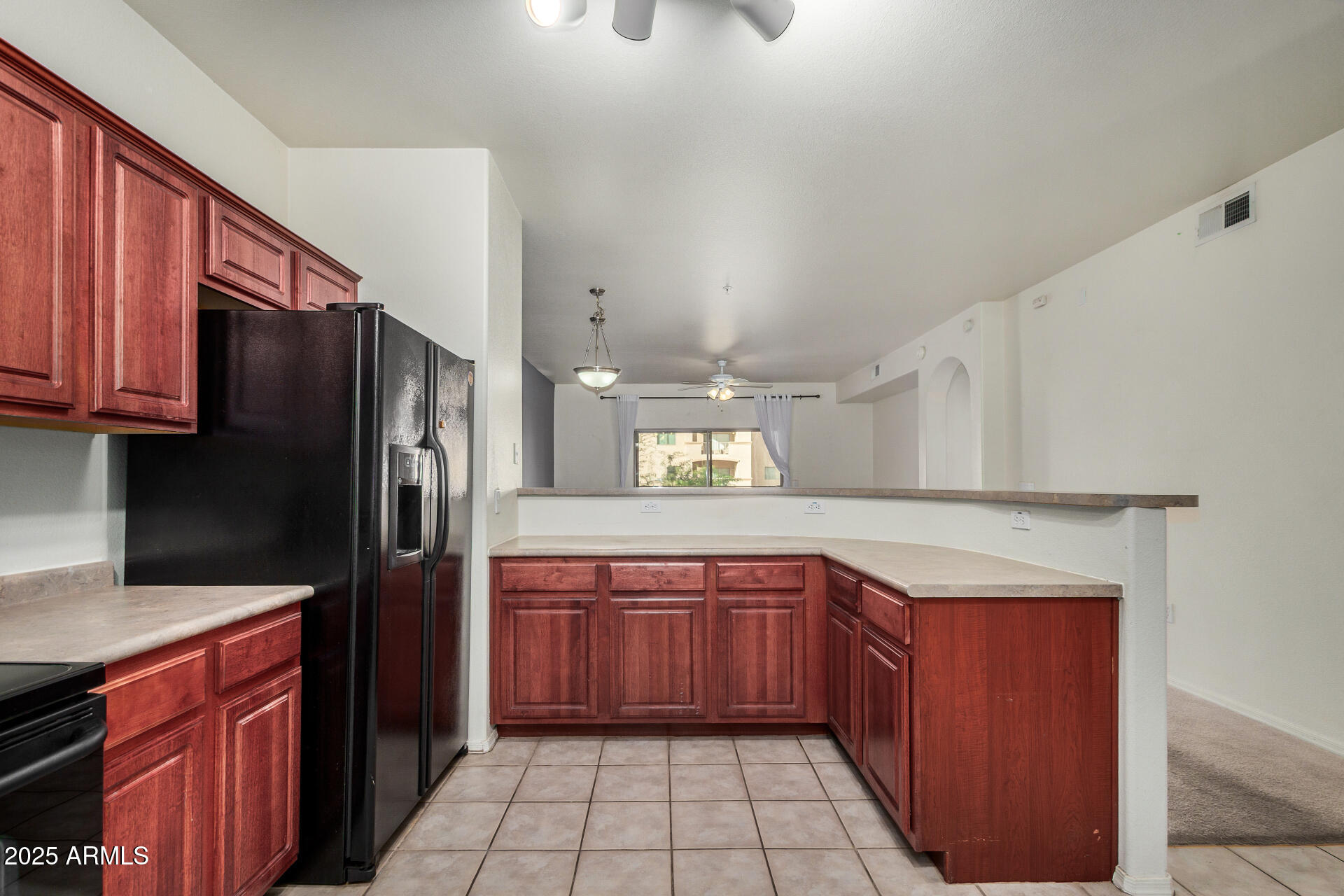 920 East Devonshire Avenue, Unit 2020 Phoenix, AZ 85014 - Photo 13 of 37 a kitchen with stainless steel appliances granite countertop a refrigerator and a sink