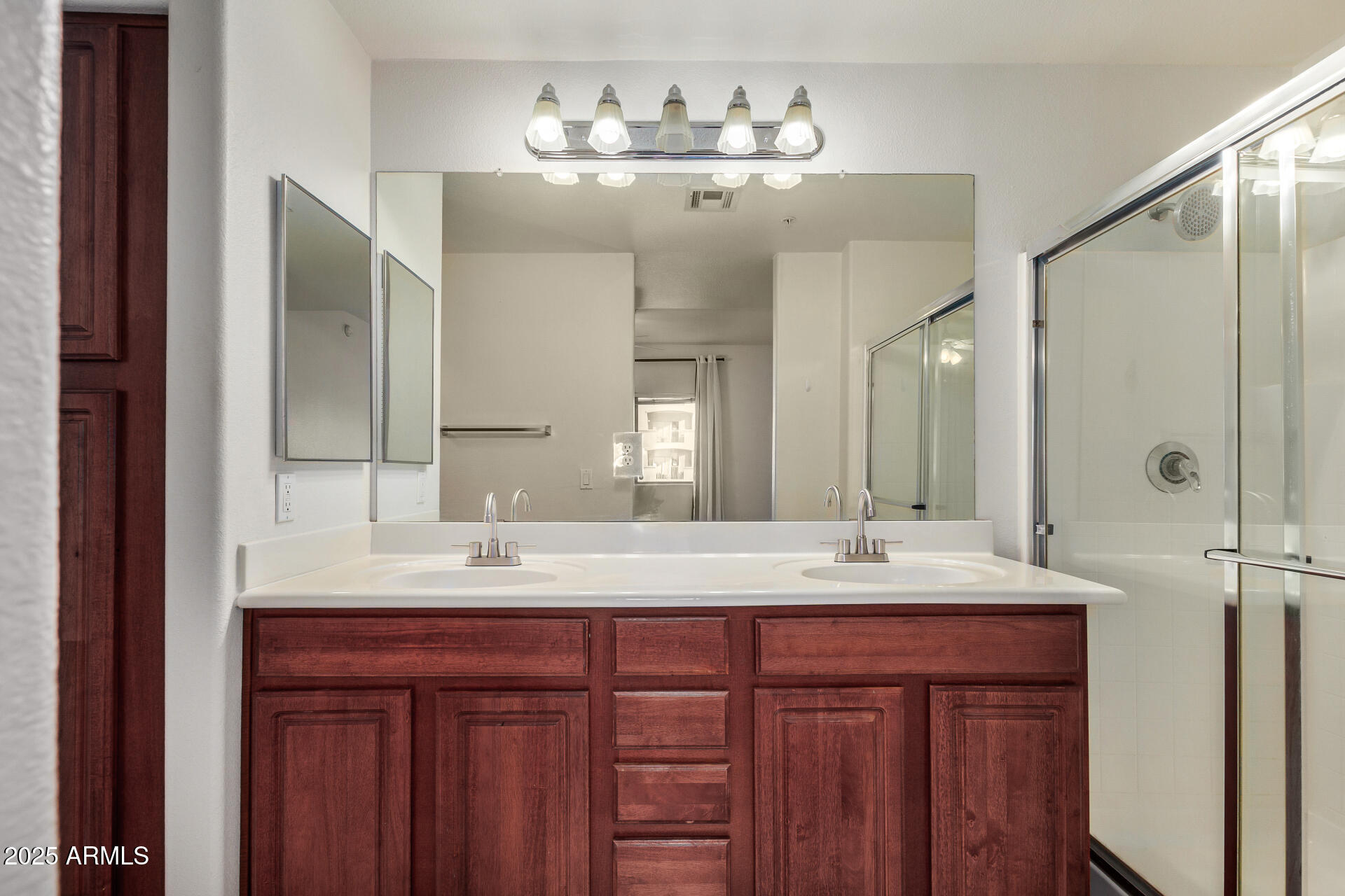 920 East Devonshire Avenue, Unit 2020 Phoenix, AZ 85014 - Photo 17 of 37 a bathroom with a double vanity sink and a mirror