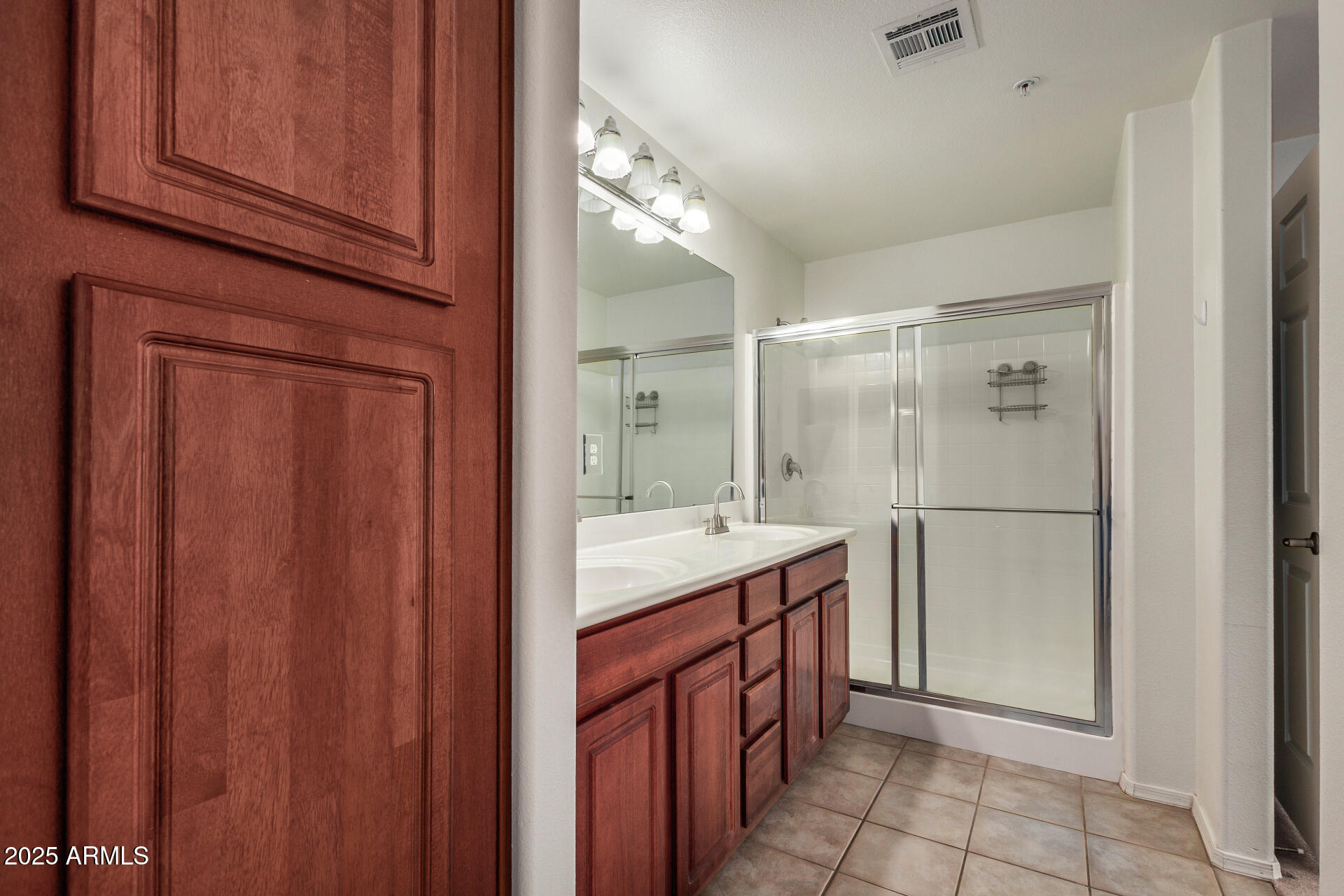 920 East Devonshire Avenue, Unit 2020 Phoenix, AZ 85014 - Photo 18 of 37 a bathroom with a double vanity sink a toilet and a mirror