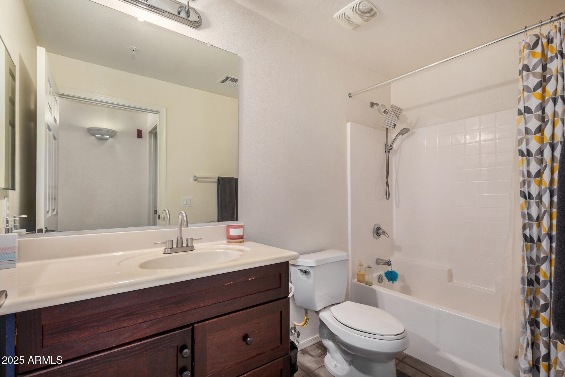 920 East Devonshire Avenue, Unit 2020 Phoenix, AZ 85014 - Photo 22 of 37 a bathroom with a sink a toilet a mirror a vanity and shower