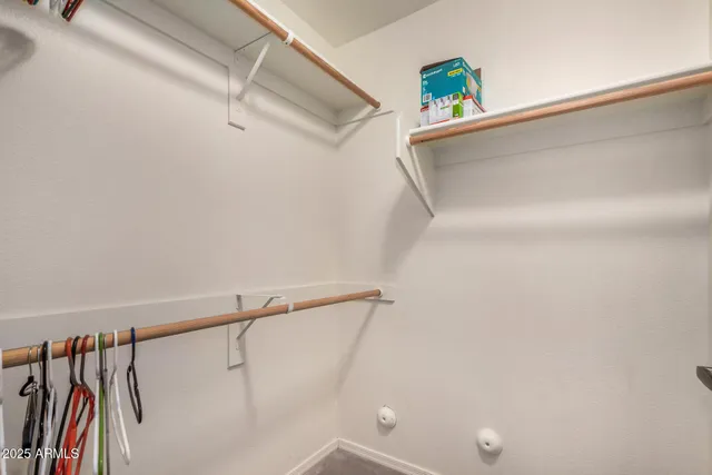 a bathroom with a sink and a washer dryer