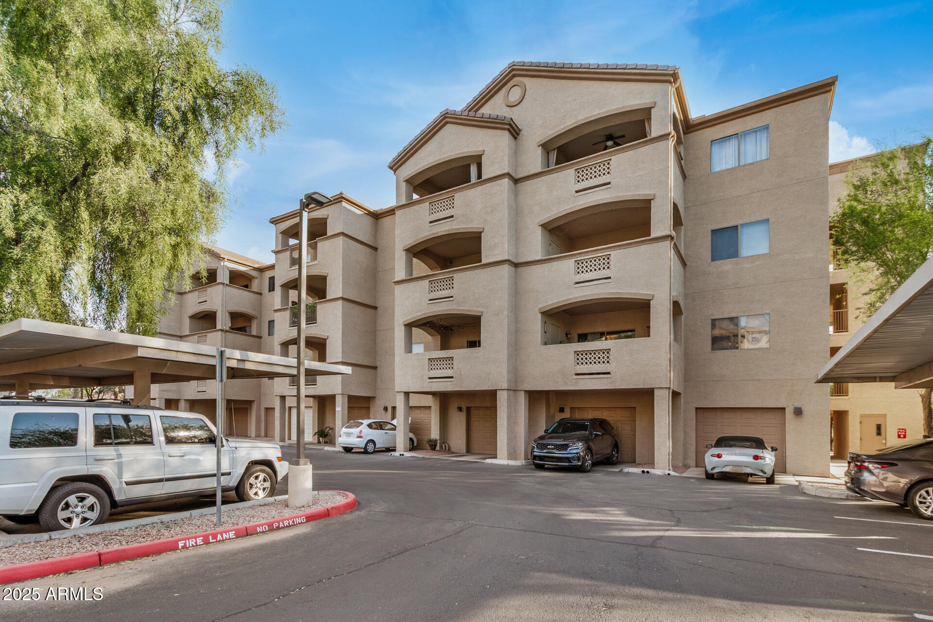 920 East Devonshire Avenue, Unit 2020 Phoenix, AZ 85014 - Photo 29 of 37 a view of a street that has couple of cars parked on the road