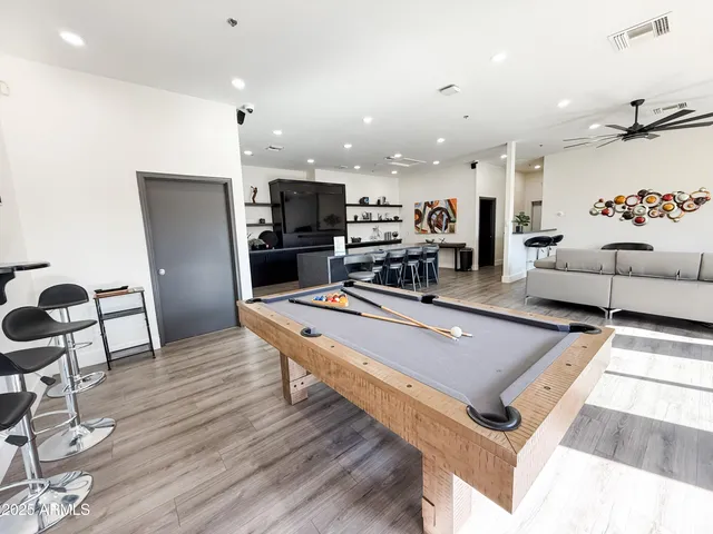 a room with gym equipment and a table