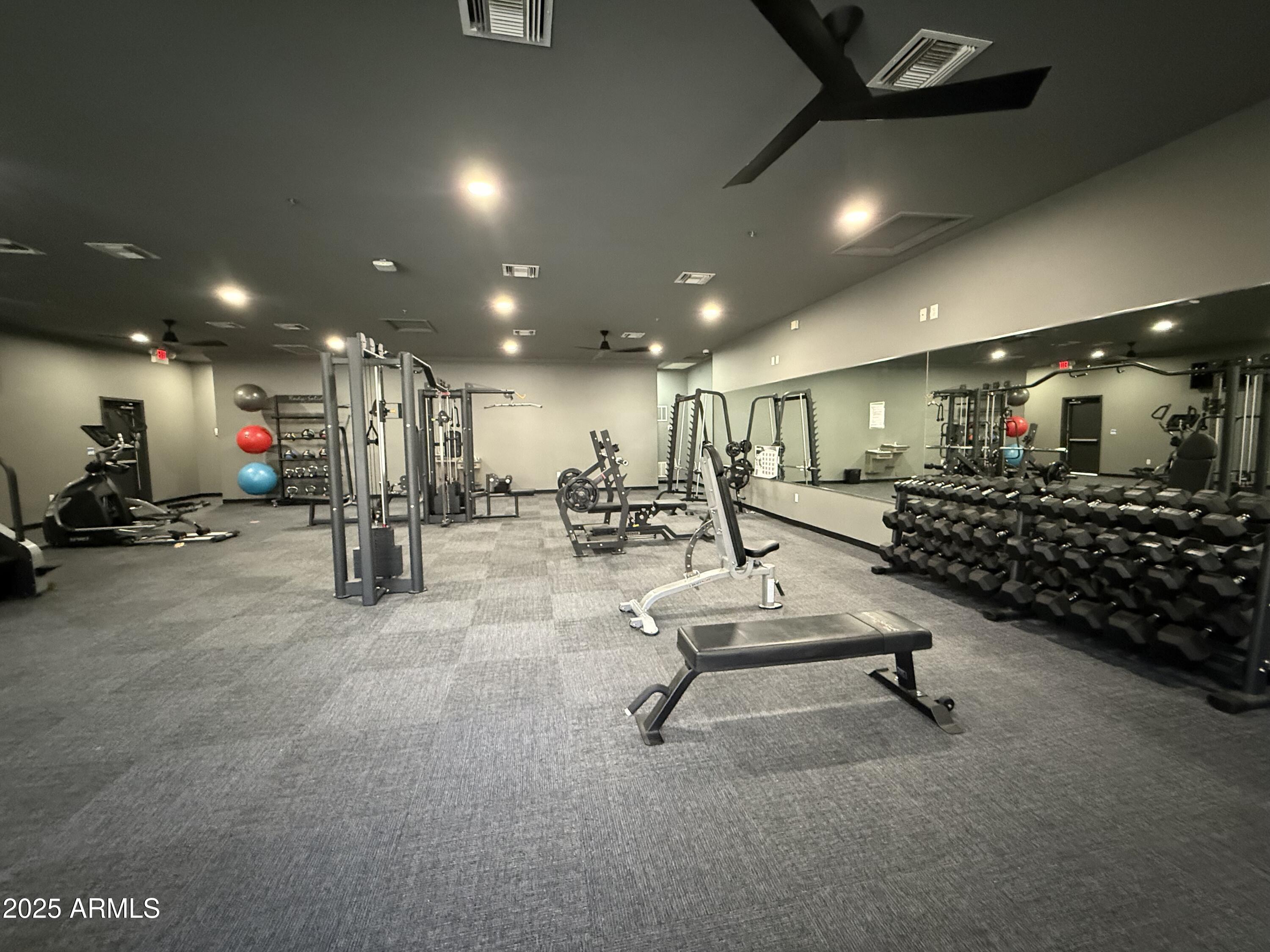 920 East Devonshire Avenue, Unit 2020 Phoenix, AZ 85014 - Photo 37 of 37 a room with gym equipment and a table
