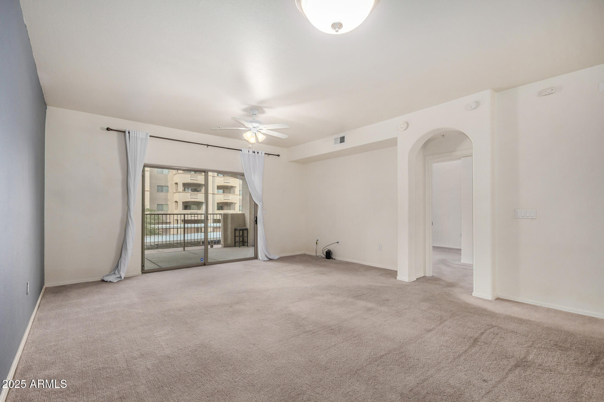 920 East Devonshire Avenue, Unit 2020 Phoenix, AZ 85014 - Photo 5 of 37 an empty room with windows